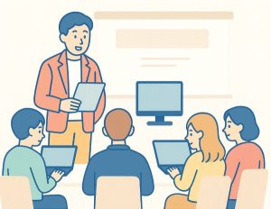 支援者養成講習会開催のイラスト。男性講師がPCを前に座っている受講生に説明している。